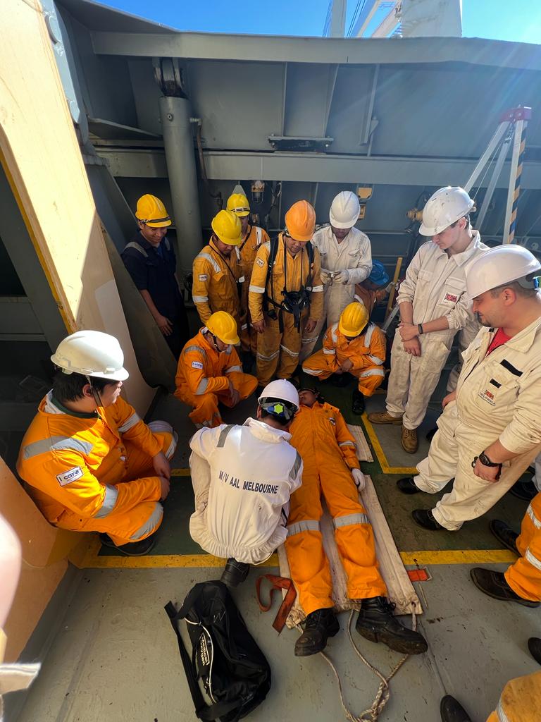 Crew members practising onboard emergency response